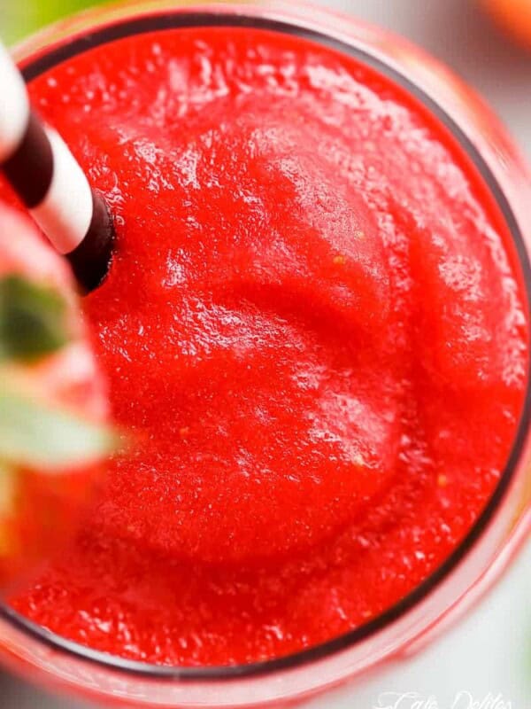 Top view of Refreshing Strawberry Rosé Slushies in a glass with straw
