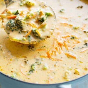 Spoon carrying on Easy Broccoli Cheddar Soup from the bowl