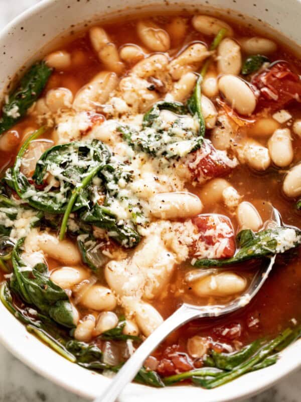 White Bean Parmesan Spinach Soup ready in 10 minutes is may kind of soup! Make a double batch and have plenty of leftovers for the weekly dinner rush!