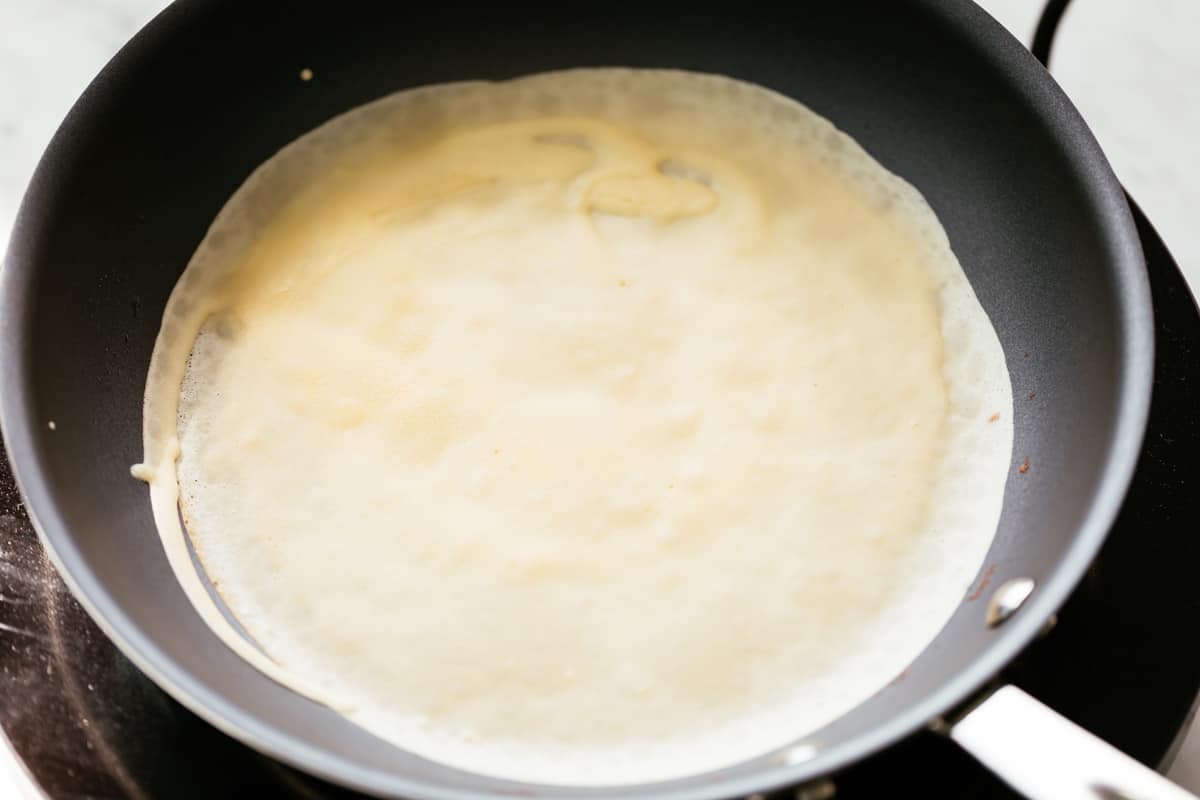Batter for crepes in a non-stick pan.