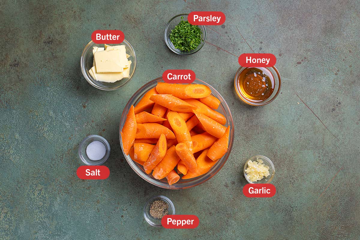 Image of the ingredients needed for the preparation of this recipe, specifically: carrots, butter, parsley, honey, garlic, salt, and pepper.